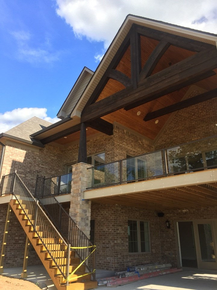 Timber-framed porch and stone pier on a Gale custom home